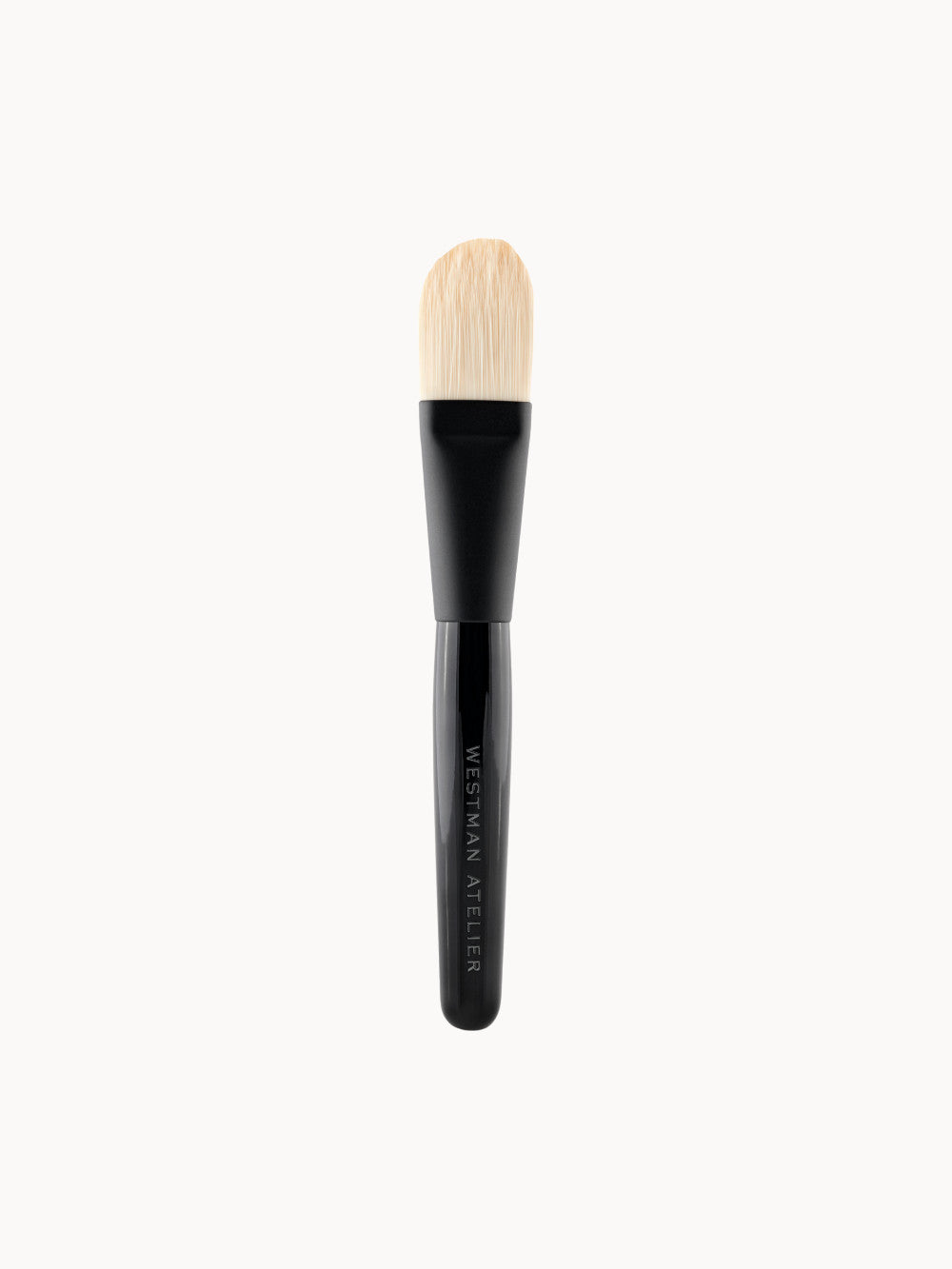 Foundation Brush von Westman Atelier – luxuriöser Make-up-Pinsel mit schwarzem Griff und dichten, hellen Borsten.