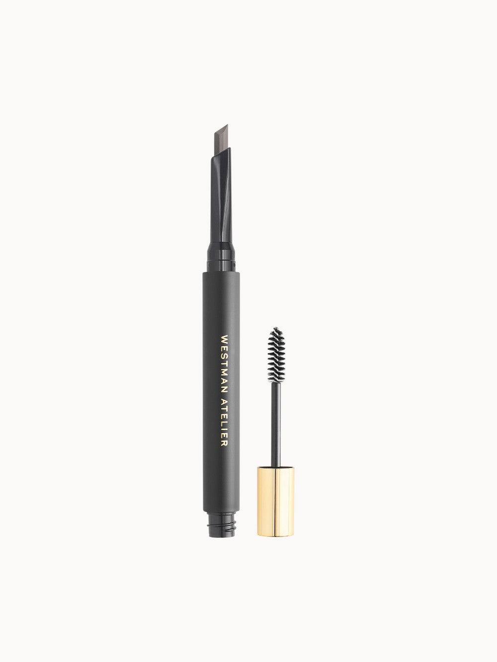 Augenbrauenstift mit goldener Kappe in Schwarz, daneben die passende rechteckige Produktverpackung mit der Aufschrift ‚Westman Atelier Brow Defining Pencil.