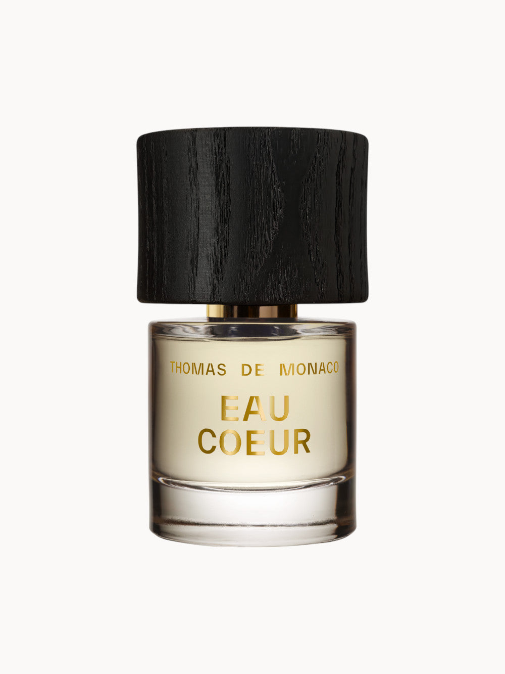 Thomas de Monaco Eau Coeur Parfumflakon – edles Nischenparfum mit hellem Duftinhalt und schwarzem Holzverschluss, minimalistisch und luxuriös gestaltet.